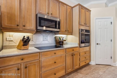 Stunning Amelia National home on a premier lot tucked into a on Amelia National Golf and Country Club in Florida - for sale on GolfHomes.com, golf home, golf lot
