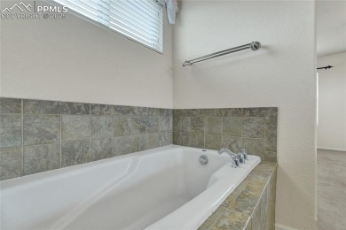 Welcoming home in a golf course community, situated on almost a on Antler Creek Golf Course in Colorado - for sale on GolfHomes.com, golf home, golf lot
