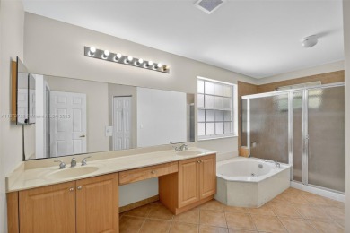 Spacious 5BR, 2.5BA home in Madison Green, Royal Palm Beach on The Links At Madison Green in Florida - for sale on GolfHomes.com, golf home, golf lot