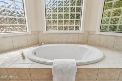 Stunning Amelia National home on a premier lot tucked into a on Amelia National Golf and Country Club in Florida - for sale on GolfHomes.com, golf home, golf lot