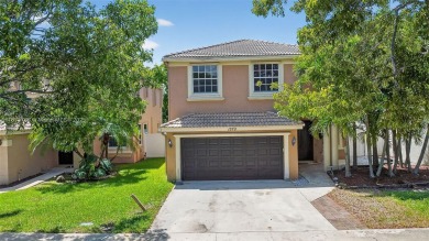 Spacious 5BR, 2.5BA home in Madison Green, Royal Palm Beach on The Links At Madison Green in Florida - for sale on GolfHomes.com, golf home, golf lot