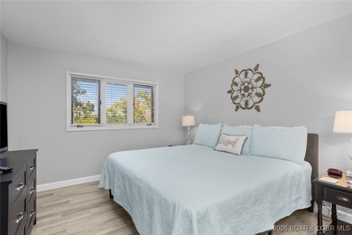 Experience unparalleled lakefront living with this stunning on The Oaks Golf Course in Missouri - for sale on GolfHomes.com, golf home, golf lot