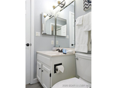 Experience unparalleled lakefront living with this stunning on The Oaks Golf Course in Missouri - for sale on GolfHomes.com, golf home, golf lot