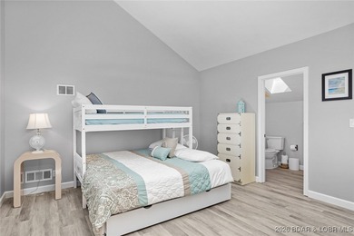 Experience unparalleled lakefront living with this stunning on The Oaks Golf Course in Missouri - for sale on GolfHomes.com, golf home, golf lot