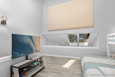 Experience unparalleled lakefront living with this stunning on The Oaks Golf Course in Missouri - for sale on GolfHomes.com, golf home, golf lot