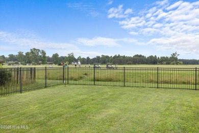 With the perfect view of the first hole at Eagle Creek Golf Club on Eagle Creek Golf Club and Grill in North Carolina - for sale on GolfHomes.com, golf home, golf lot