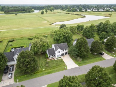 With the perfect view of the first hole at Eagle Creek Golf Club on Eagle Creek Golf Club and Grill in North Carolina - for sale on GolfHomes.com, golf home, golf lot
