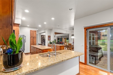 Set along the 2nd green in the prestigious Eagle Bend Golf on Eagle Bend Golf Course in Montana - for sale on GolfHomes.com, golf home, golf lot