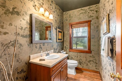 Set along the 2nd green in the prestigious Eagle Bend Golf on Eagle Bend Golf Course in Montana - for sale on GolfHomes.com, golf home, golf lot