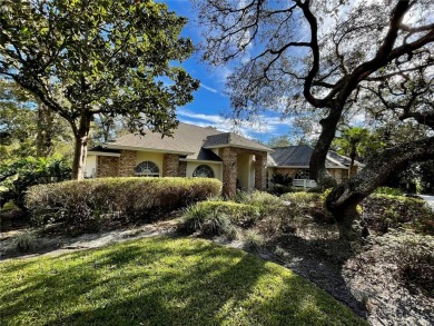 Absolutely stunning 4 bedroom, 2 bath executive home on almost 2 on Walden Lake Golf and Country Club  in Florida - for sale on GolfHomes.com, golf home, golf lot