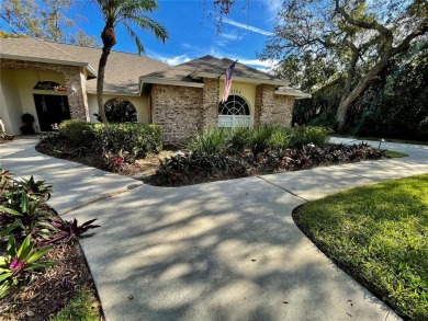 Absolutely stunning 4 bedroom, 2 bath executive home on almost 2 on Walden Lake Golf and Country Club  in Florida - for sale on GolfHomes.com, golf home, golf lot