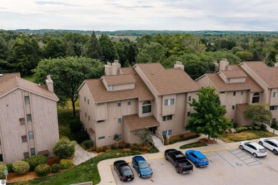 Perched above the third tee of Spruce Run Golf Course, this on Grand Traverse Resort and Spa in Michigan - for sale on GolfHomes.com, golf home, golf lot