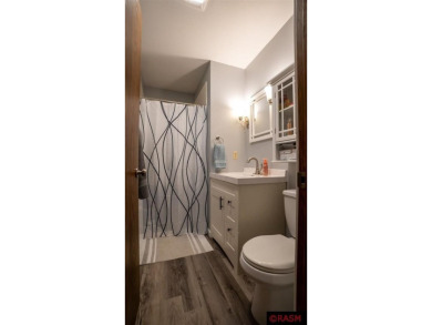 Step into this inviting 3-bedroom, 3-bathroom home where on New Ulm Country Club in Minnesota - for sale on GolfHomes.com, golf home, golf lot