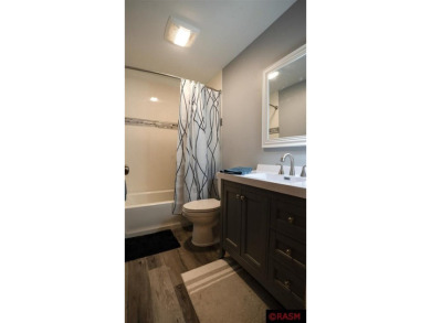 Step into this inviting 3-bedroom, 3-bathroom home where on New Ulm Country Club in Minnesota - for sale on GolfHomes.com, golf home, golf lot