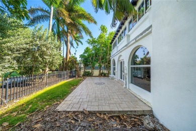 TWO STORY HOME ON THE LA GORCE COUNTRY CLUB GOLF COURSE IN THE on La Gorce Country Club in Florida - for sale on GolfHomes.com, golf home, golf lot