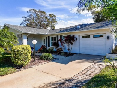 Welcome to a Retreat in Charm at 122 Stafford Dr., Palm Harbor on Highland Lakes Executive Golf Course in Florida - for sale on GolfHomes.com, golf home, golf lot