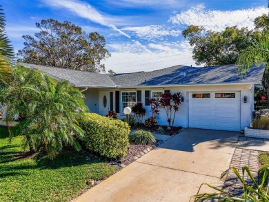 Welcome to a Retreat in Charm at 122 Stafford Dr., Palm Harbor on Highland Lakes Executive Golf Course in Florida - for sale on GolfHomes.com, golf home, golf lot