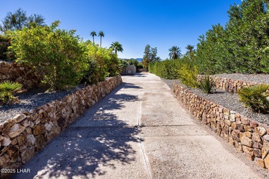 Located in the heart of the golf course area, this stunning on London Bridge Golf Course in Arizona - for sale on GolfHomes.com, golf home, golf lot