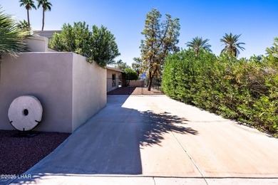 Located in the heart of the golf course area, this stunning on London Bridge Golf Course in Arizona - for sale on GolfHomes.com, golf home, golf lot