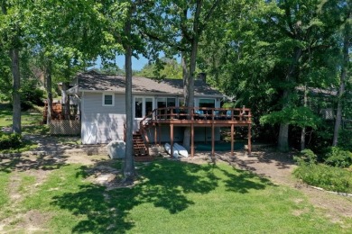 Welcome to a tranquil waterfront retreat nestled in the trees in on Hide-A-Way Lake Golf Course in Texas - for sale on GolfHomes.com, golf home, golf lot