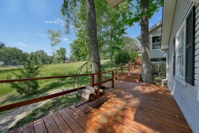 Welcome to a tranquil waterfront retreat nestled in the trees in on Hide-A-Way Lake Golf Course in Texas - for sale on GolfHomes.com, golf home, golf lot