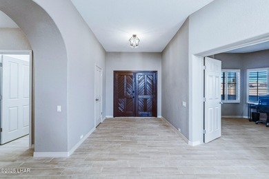 Experience luxury living in this beautiful 3-bedroom, 3-bathroom on London Bridge Golf Course in Arizona - for sale on GolfHomes.com, golf home, golf lot