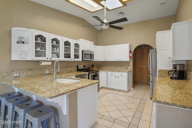 Welcome to your Havasu getaway-where lake views, golf course on London Bridge Golf Course in Arizona - for sale on GolfHomes.com, golf home, golf lot