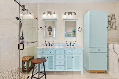 This beautifully renovated 1st-floor villa with golf course on Santa Lucia River Club in Florida - for sale on GolfHomes.com, golf home, golf lot