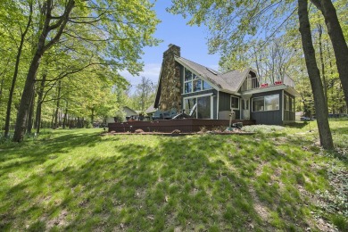 Welcome to your dream home with front-row views of the 5th hole on Canadian Lakes Country Club-The Highlands Course in Michigan - for sale on GolfHomes.com, golf home, golf lot