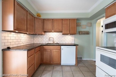 Welcome to this charming Royal Oak bungalow featuring three on Red Run Golf Club in Michigan - for sale on GolfHomes.com, golf home, golf lot
