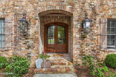 Welcome home to this timeless beauty on Fenwick Circle in on Reunion Golf Club in Mississippi - for sale on GolfHomes.com, golf home, golf lot