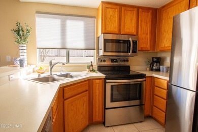 Directly on the Golf Course with a protected back and side patio on London Bridge Golf Course in Arizona - for sale on GolfHomes.com, golf home, golf lot