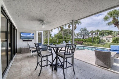 Serene water views frame this totally remodeled and well on Frenchmans Creek Country Club in Florida - for sale on GolfHomes.com, golf home, golf lot