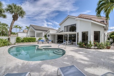 Serene water views frame this totally remodeled and well on Frenchmans Creek Country Club in Florida - for sale on GolfHomes.com, golf home, golf lot