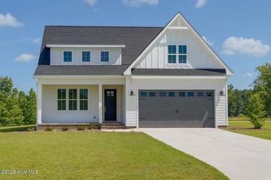 Modern Farmhouse Living Meets Coastal ConvenienceThis modern on River Landing Golf Course in North Carolina - for sale on GolfHomes.com, golf home, golf lot