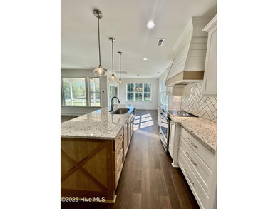 Modern Farmhouse Living Meets Coastal ConvenienceThis modern on River Landing Golf Course in North Carolina - for sale on GolfHomes.com, golf home, golf lot