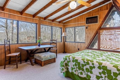 Escape to this charming, rustic A-frame chalet at Innsbrook on Innsbrook Resort Golf Course in Missouri - for sale on GolfHomes.com, golf home, golf lot