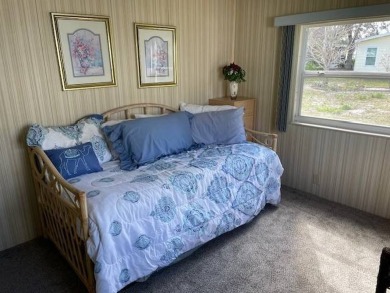 Manufactured Home on Leased Land with Lot Rent. Cute and cozy 2 on Whisperwood Golf Course in Florida - for sale on GolfHomes.com, golf home, golf lot