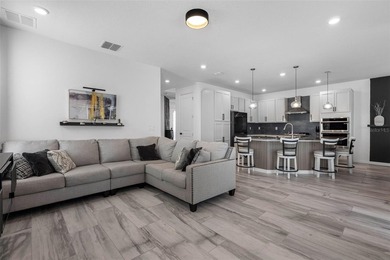 Gorgeous pool home in the gated resort-style community of on Apollo Beach Golf and Sea Club in Florida - for sale on GolfHomes.com, golf home, golf lot