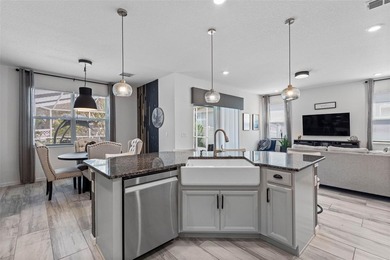 Gorgeous pool home in the gated resort-style community of on Apollo Beach Golf and Sea Club in Florida - for sale on GolfHomes.com, golf home, golf lot