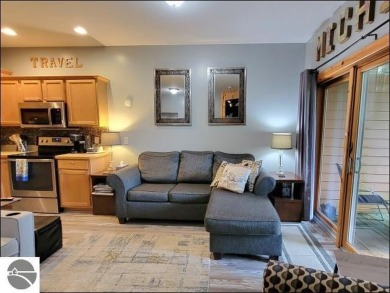 Enjoy resort-style living in this beautifully furnished condo on Schuss Mountain Golf Club in Michigan - for sale on GolfHomes.com, golf home, golf lot
