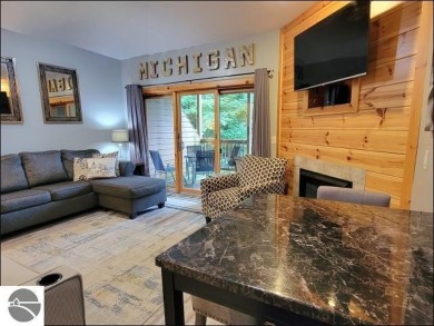 Enjoy resort-style living in this beautifully furnished condo on Schuss Mountain Golf Club in Michigan - for sale on GolfHomes.com, golf home, golf lot