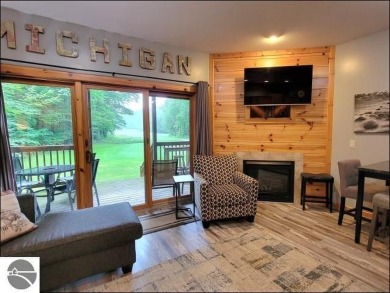 Enjoy resort-style living in this beautifully furnished condo on Schuss Mountain Golf Club in Michigan - for sale on GolfHomes.com, golf home, golf lot