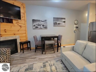 Enjoy resort-style living in this beautifully furnished condo on Schuss Mountain Golf Club in Michigan - for sale on GolfHomes.com, golf home, golf lot