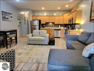 Enjoy resort-style living in this beautifully furnished condo on Schuss Mountain Golf Club in Michigan - for sale on GolfHomes.com, golf home, golf lot