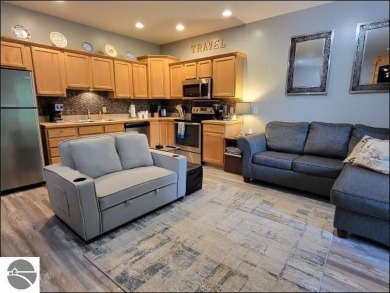 Enjoy resort-style living in this beautifully furnished condo on Schuss Mountain Golf Club in Michigan - for sale on GolfHomes.com, golf home, golf lot