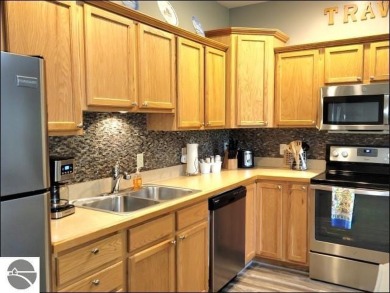 Enjoy resort-style living in this beautifully furnished condo on Schuss Mountain Golf Club in Michigan - for sale on GolfHomes.com, golf home, golf lot