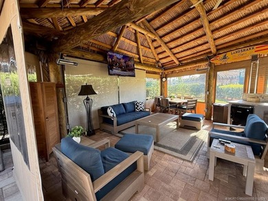 A SPORT LOVER'S DREAM WITH PRIVACY AND COMFORT! Perfectly on St. Lucie Trail Golf Club in Florida - for sale on GolfHomes.com, golf home, golf lot