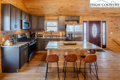 This charming Creekside cabin offers the perfect blend of on Beech Mountain Club in North Carolina - for sale on GolfHomes.com, golf home, golf lot