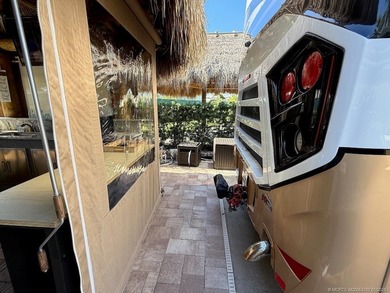 A SPORT LOVER'S DREAM WITH PRIVACY AND COMFORT! Perfectly on St. Lucie Trail Golf Club in Florida - for sale on GolfHomes.com, golf home, golf lot